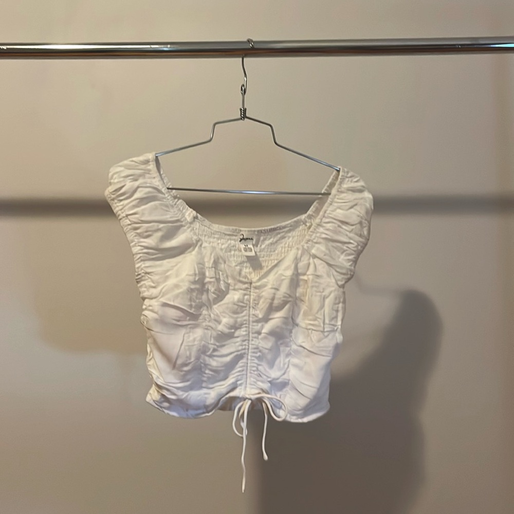 Lightly worn white crop top. Cinch tie, poofy sleeves. Super simple.